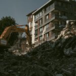Excavator removing rubble from a collapsed building area in Antakya, Türkiye.