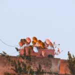A view of various satellite dishes atop a rooftop in Tanger, Morocco.