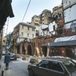 Street scene in Beirut depicting building damage and recovery efforts after the port explosion.