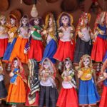 Vibrant display of traditional Rajasthani puppets with colorful attire, showcasing cultural artistry.