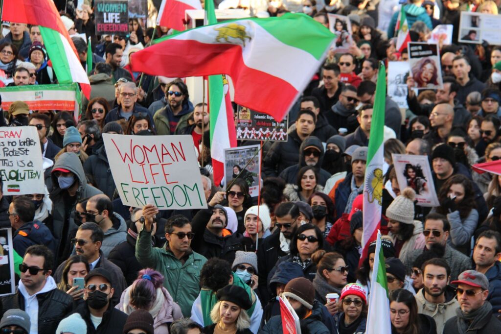 A vibrant protest in Vancouver advocating for freedom and women's rights.