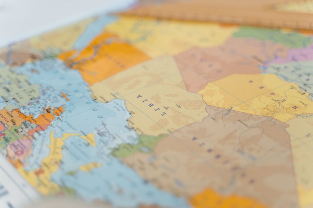 Colorful world map close-up showing African countries with focus on Libya and surrounding areas.