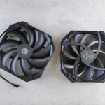 Top view of two black cooling fans on a gray concrete surface, showcasing technology equipment.